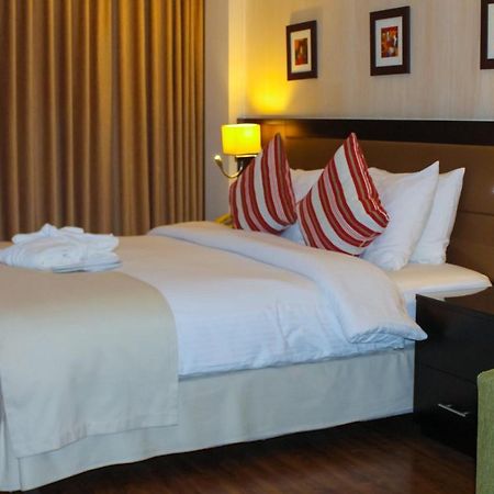 Oryx Hotel Aqaba Esterno foto A bedroom at the hotel